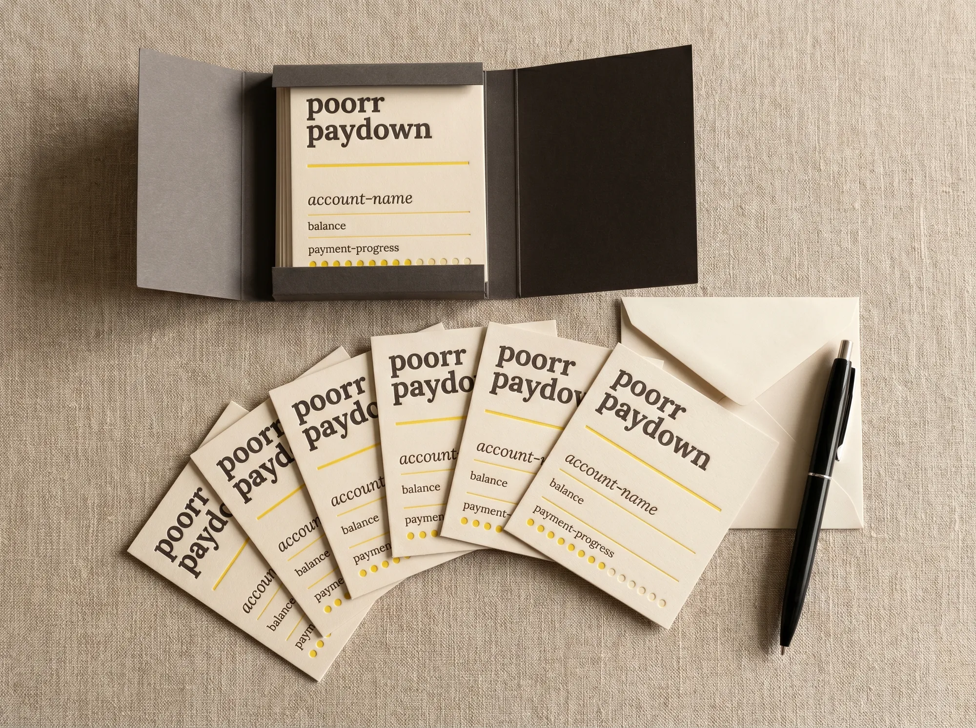 Poorr Paydown Card Set (Stationery) — A flat case of fifty letterpress paydown-tracker cards — wordmark, account-name line, balance row, citrus payment-progress dots.